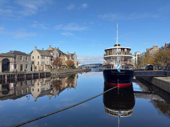 Image of a boat and building on Leith waterfront in Edinburgh.