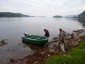 Andy and Jim setting off on a plankton-tow on a midgey morning at the field station.
