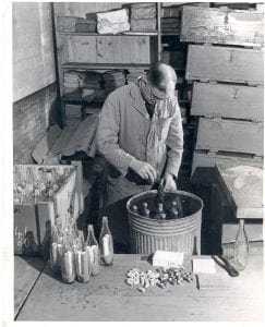 Rognvald Livinstone ballasting glass drift bottles before their release at sea