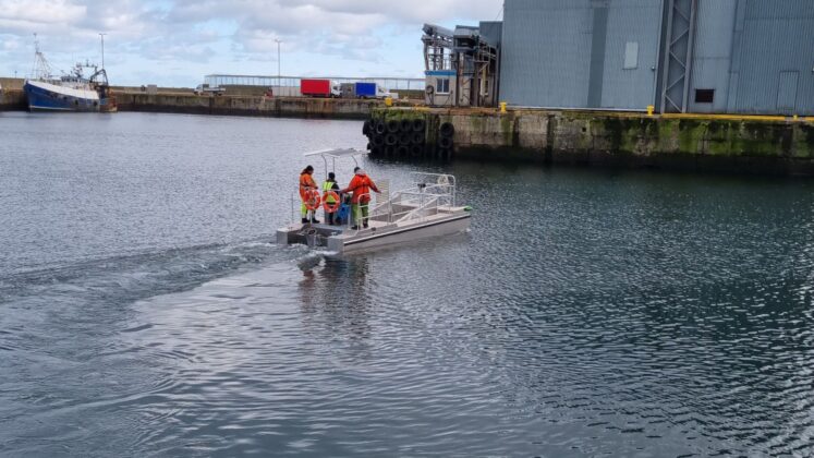 Some of the Fraserburgh Harbour marine team on all-electric vessel in Fraserburgh Harbour