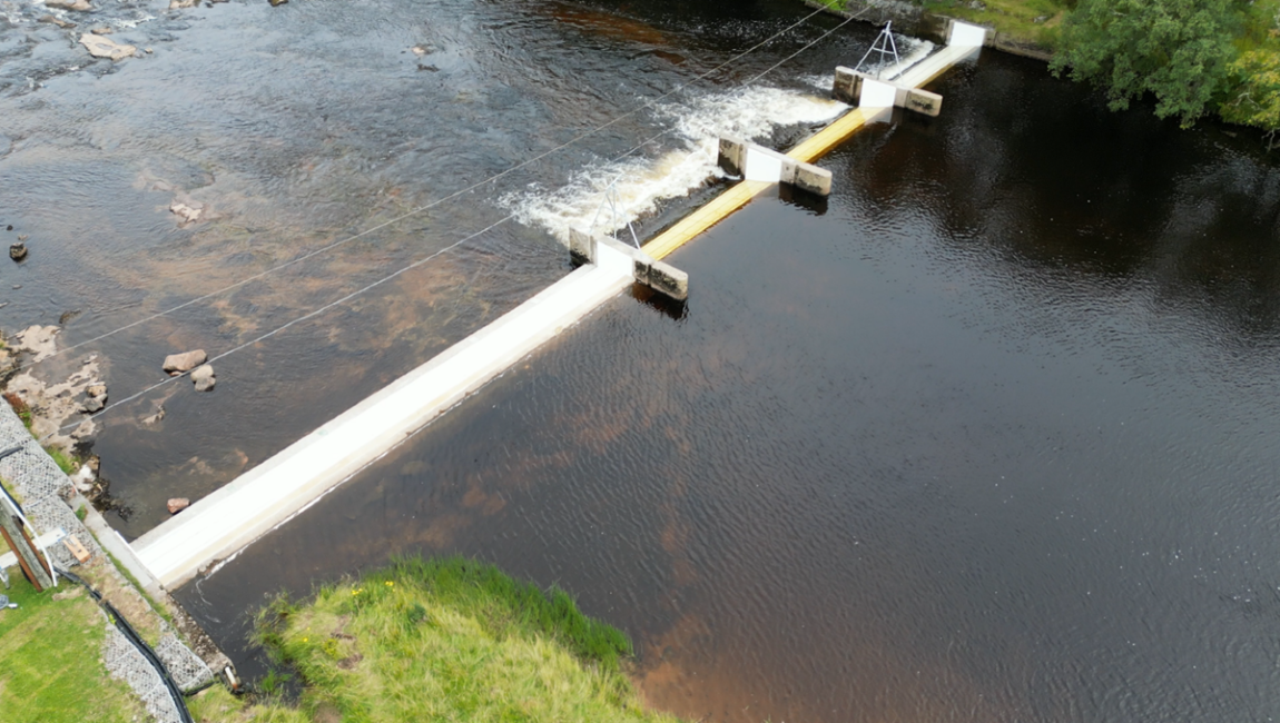 Overhead image of the weir showing the four channels, with the new plastic insulation panels and the CCTV gantries.