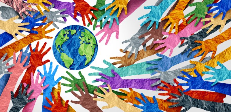 Collage of lots of different coloured hands and planet Earth - Lightspring