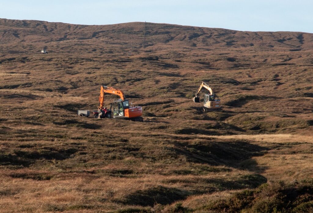 Excavators on site Two excavators work to reprofile areas of peatland at a Peatland ACTION-funded restoration site near Girlsta, Shetland Image credit: © Shetland Islands Council