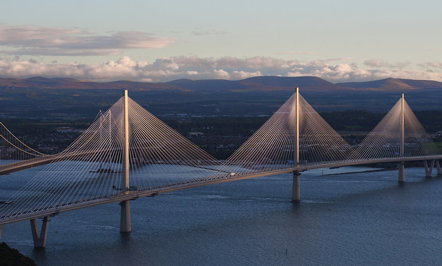 An aerial shot of the queensferry crossing with the forth road bridge in the background